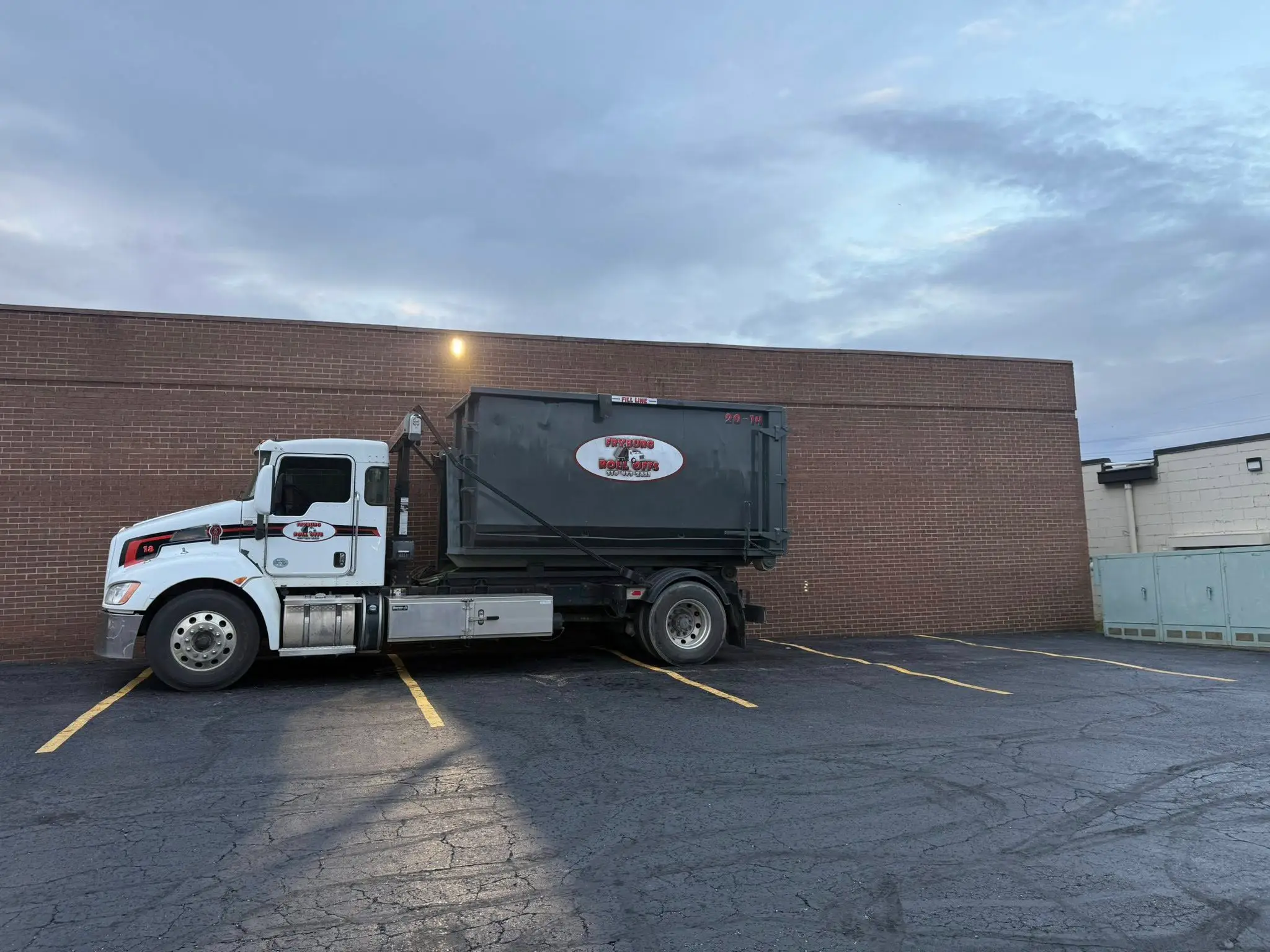 Fryburg Roll Offs dumpster on job site New Philadelphia Ohio